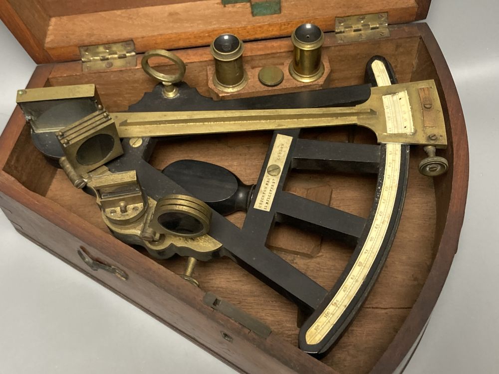 A 19th century ebony and brass octant by Crichton Bros, Billiter St, London, with ivory scale